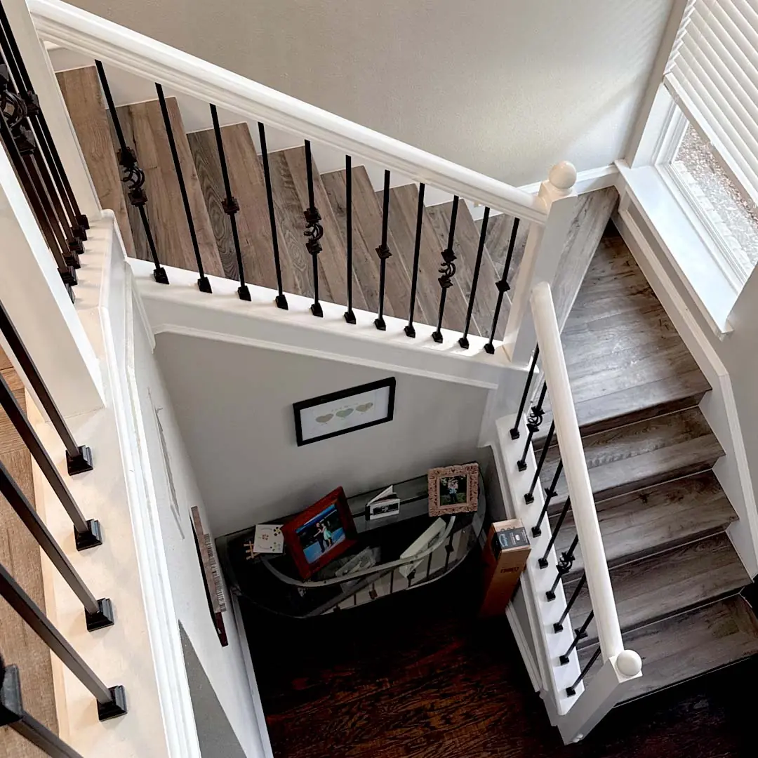 Mohawk RevWood® Rare Vintage laminate wood in Doeskin Gray Staircase Remodel by Flooring Direct