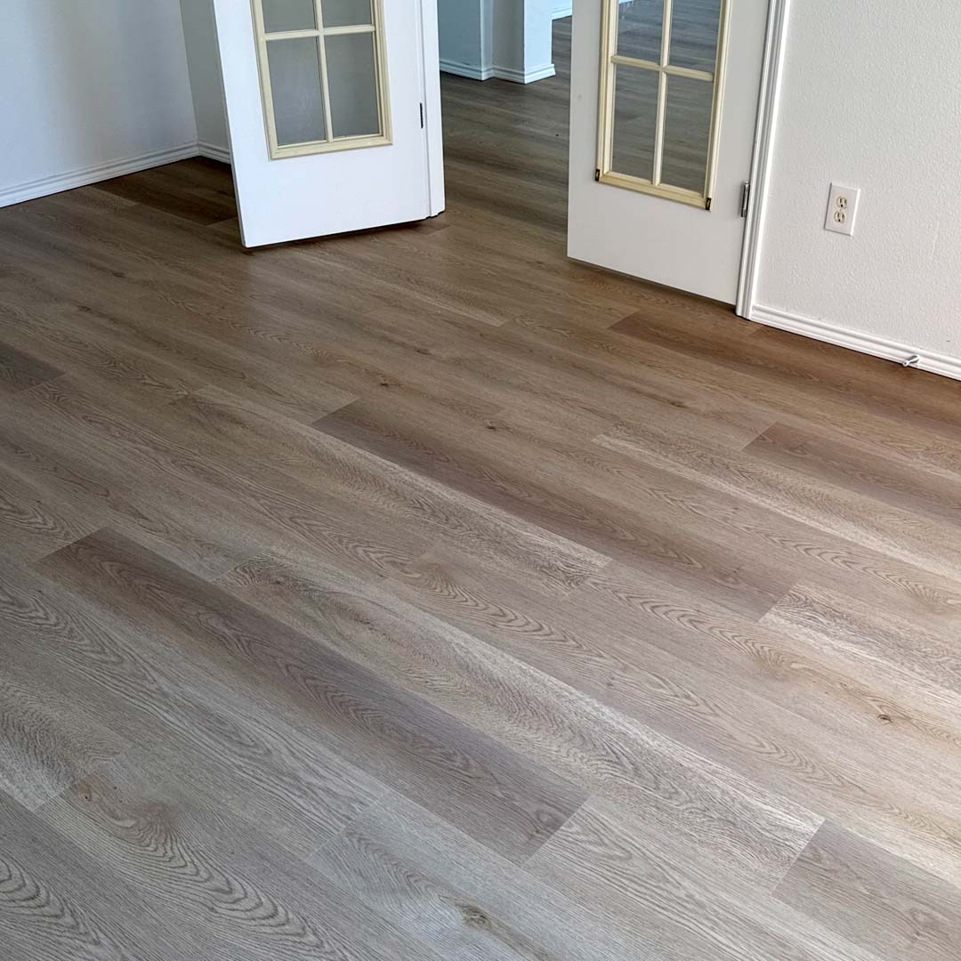 Green Touch Flooring's Aspen Collection SPC Wood-Look Flooring in the color Staten Island installed by the experts Flooring Direct DFW in Fort Worth, Texas