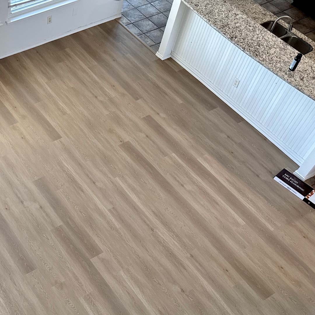 Green Touch Flooring's Aspen Collection SPC Wood-Look Flooring in the color Staten Island installed by the experts Flooring Direct DFW in Fort Worth, Texas